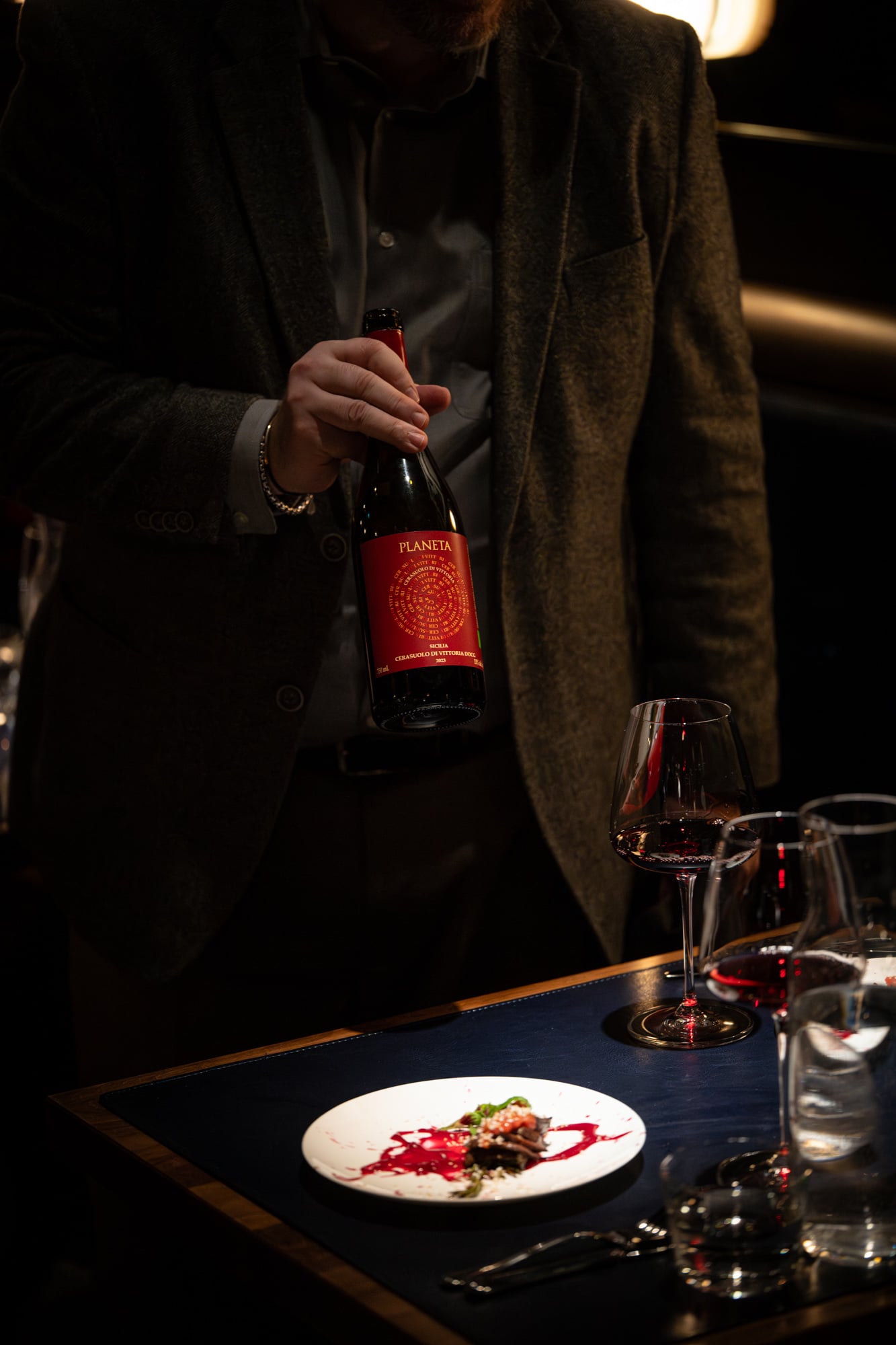 Sommelier presenting a bottle of wine